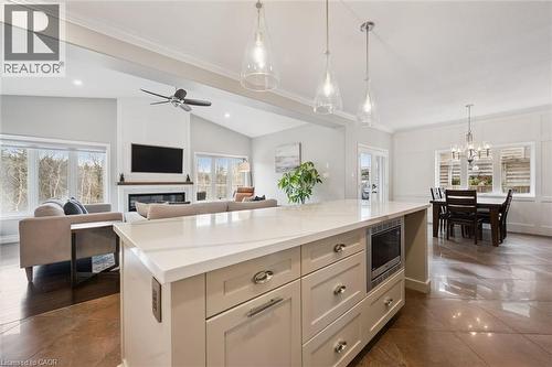 Kitchen featuring vaulted ceiling, a center island, open floor plan, healthy amount of natural light, and stainless steel microwave - 469 Woodbine Avenue, Kitchener, ON - Indoor Photo Showing Other Room