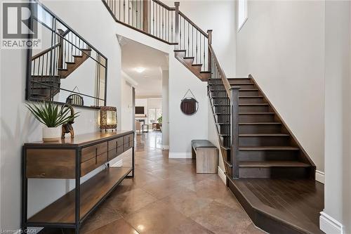 Stairway featuring a high ceiling and baseboards - 469 Woodbine Avenue, Kitchener, ON - Indoor Photo Showing Other Room