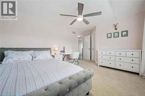 Bedroom featuring light colored carpet and ceiling fan - 469 Woodbine Avenue, Kitchener, ON - Indoor Photo Showing Bedroom