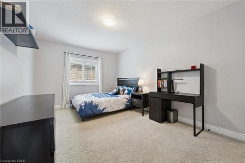 Bedroom featuring baseboards and light colored carpet - 469 Woodbine Avenue, Kitchener, ON - Indoor Photo Showing Bedroom