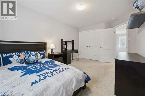 Bedroom with light carpet and a closet - 469 Woodbine Avenue, Kitchener, ON - Indoor Photo Showing Bedroom