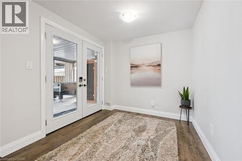 Unfurnished room featuring french doors and dark wood-style floors - 469 Woodbine Avenue, Kitchener, ON - Indoor Photo Showing Other Room