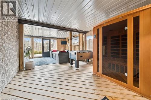 Unfurnished sunroom featuring a relaxing sauna, a deck, and an outdoor hangout area - 469 Woodbine Avenue, Kitchener, ON - Outdoor With Deck Patio Veranda With Exterior
