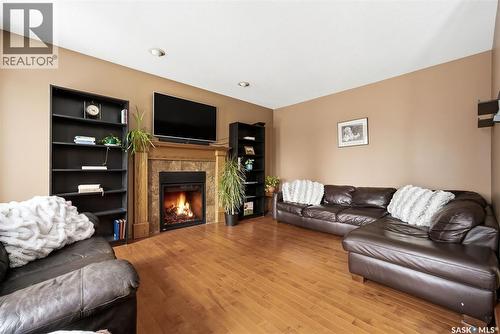 3803 Bow Bay, Regina, SK - Indoor Photo Showing Living Room With Fireplace