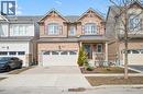 Craftsman-style house featuring brick siding, covered porch, driveway, and a garage - 38 Park Glen Street, Kitchener, ON  - Outdoor With Facade 
