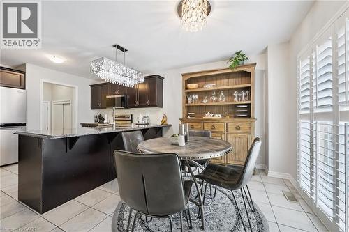 Dining space featuring suspended lighting and light tile patterned flooring - 38 Park Glen Street, Kitchener, ON - Indoor Photo Showing Other Room