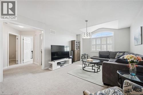 Living room with light carpet and vaulted ceiling - 38 Park Glen Street, Kitchener, ON - Indoor Photo Showing Living Room
