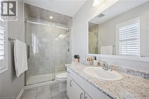 Full bathroom featuring healthy amount of natural light, vanity, a shower stall, and light marble finish flooring - 38 Park Glen Street, Kitchener, ON - Indoor Photo Showing Bathroom