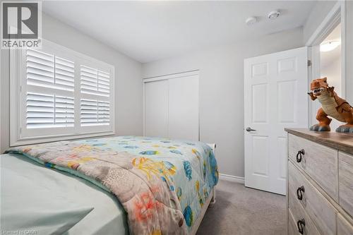 Bedroom with dark colored carpet and a closet - 38 Park Glen Street, Kitchener, ON - Indoor Photo Showing Bedroom