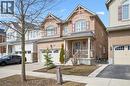 Craftsman-style house featuring covered porch, brick siding, an attached garage, and driveway - 38 Park Glen Street, Kitchener, ON  - Outdoor With Facade 