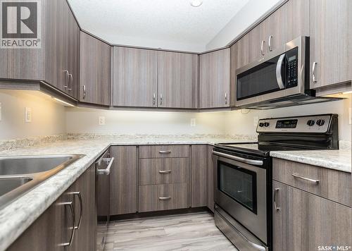 4307 108 Willis Crescent, Saskatoon, SK - Indoor Photo Showing Kitchen With Stainless Steel Kitchen With Double Sink With Upgraded Kitchen