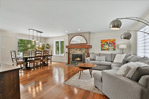 Living Room - 43 Rue De Charny, Lorraine, QC - Indoor Photo Showing Living Room With Fireplace