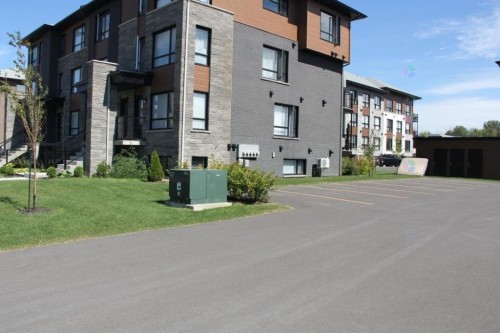 Parking - 3888 Rue Bernard-Hubert, Longueuil (Saint-Hubert), QC - Outdoor With Facade