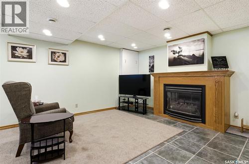 7322 Cribbs Bay, Regina, SK - Indoor With Fireplace