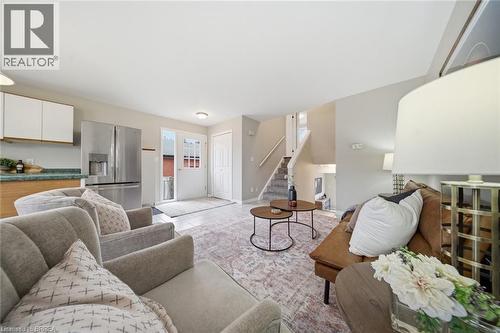 Living area featuring stairway and light tile patterned floors - 7 Forest Drive, Paris, ON - Indoor Photo Showing Living Room