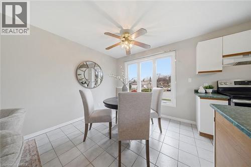 Dining room with ceiling fan and light tile patterned flooring - 7 Forest Drive, Paris, ON - Indoor Photo Showing Other Room