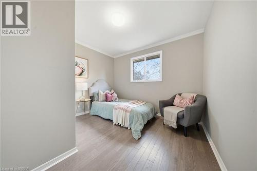 Bedroom with crown molding and wood finished floors - 7 Forest Drive, Paris, ON - Indoor Photo Showing Bedroom