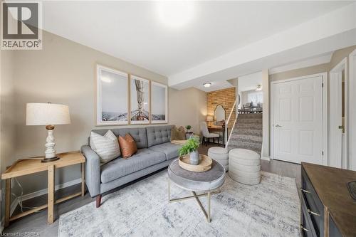 Living room featuring wood finished floors and a ceiling fan - 7 Forest Drive, Paris, ON - Indoor Photo Showing Living Room
