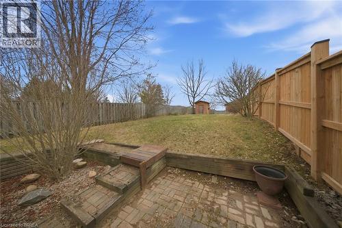Fenced backyard with a storage unit and a patio area - 7 Forest Drive, Paris, ON - Outdoor