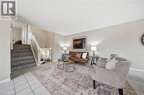 Living area with stairway and light tile patterned floors - 7 Forest Drive, Paris, ON - Indoor Photo Showing Living Room