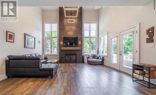 Living Room Showcases a Soaring Cathedral Ceiling - 2163 Deyncourt Drive, Burlington, ON - Indoor Photo Showing Living Room With Fireplace