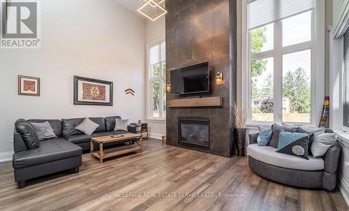 Dramatic Gas Fireplace in the Living Room - 2163 Deyncourt Drive, Burlington, ON - Indoor Photo Showing Living Room With Fireplace