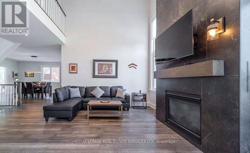 Engineered Hardwood Flooring T/O the Main Level - 2163 Deyncourt Drive, Burlington, ON - Indoor Photo Showing Living Room With Fireplace