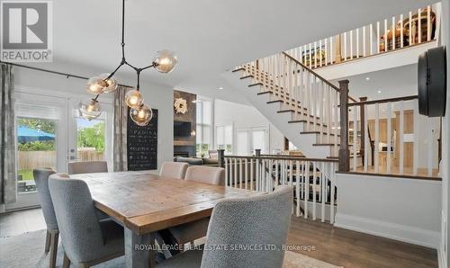 A Hardwood Staircase Leads to the Upper Level - 2163 Deyncourt Drive, Burlington, ON - Indoor Photo Showing Dining Room