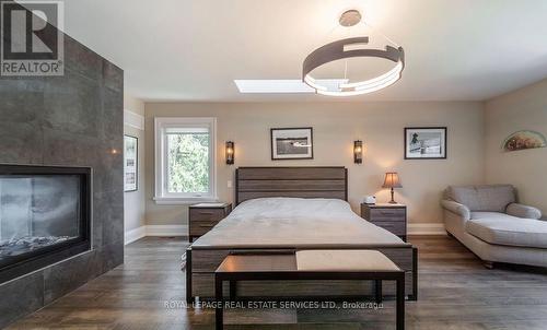 Private Primary Retreat Features a Walk-In Closet - 2163 Deyncourt Drive, Burlington, ON - Indoor Photo Showing Bedroom With Fireplace