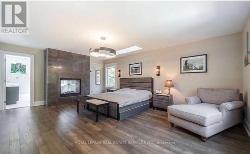 Two-Sided Gas Fireplace in the Primary Retreat - 2163 Deyncourt Drive, Burlington, ON - Indoor Photo Showing Bedroom