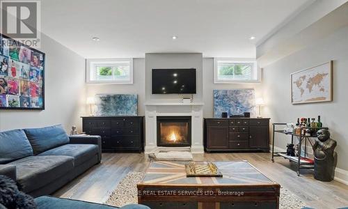 Recreation Area with Gas Fireplace & Laminate Flr. - 2163 Deyncourt Drive, Burlington, ON - Indoor Photo Showing Living Room With Fireplace