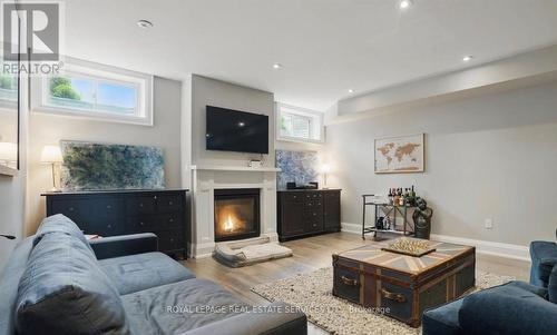 Recreation Area with Gas Fireplace & Laminate Flr. - 2163 Deyncourt Drive, Burlington, ON - Indoor Photo Showing Living Room With Fireplace