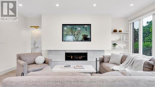 3998 Big Leaf Trail, London South (South V), ON - Indoor Photo Showing Living Room With Fireplace