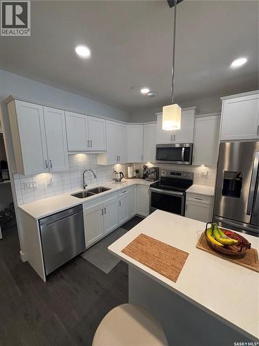 113 105 Willis Crescent, Saskatoon, SK - Indoor Photo Showing Kitchen With Double Sink