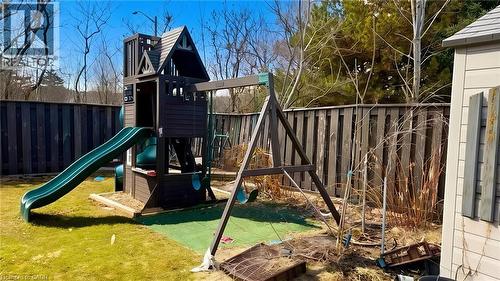 View of play area with a fenced backyard - 416 Warrington Drive, Waterloo, ON - Outdoor