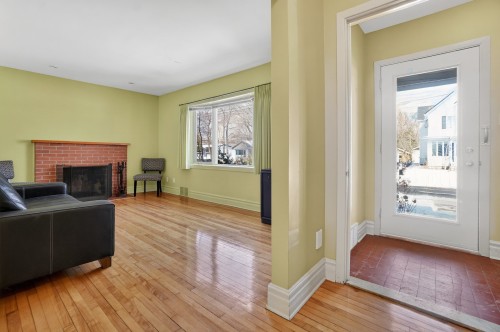 Living Room - 71 Av. Edison, Saint-Lambert, QC - Indoor Photo Showing Other Room With Fireplace