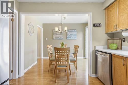Dining space with light wood-style flooring and hanging lights - 18 Webster Way, Georgetown, ON - Indoor Photo Showing Other Room