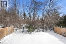 Yard layered in snow featuring view of wooded area - 18 Webster Way, Georgetown, ON  - Outdoor 