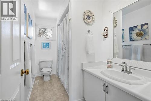 Bathroom with vanity, curtained shower, and light tile patterned flooring - 18 Webster Way, Georgetown, ON - Indoor Photo Showing Bathroom