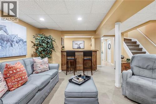 Living area with a drop ceiling, a dry bar, light colored carpet, and recessed lighting - 18 Webster Way, Georgetown, ON - Indoor