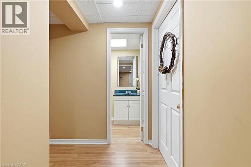 Hall featuring a paneled ceiling and light wood finished floors - 18 Webster Way, Georgetown, ON - Indoor Photo Showing Other Room