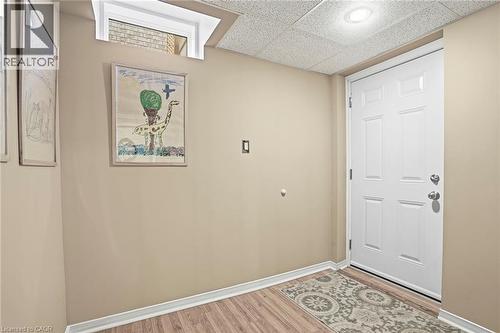 Entryway featuring a paneled ceiling and wood finished floors - 18 Webster Way, Georgetown, ON - Indoor Photo Showing Other Room