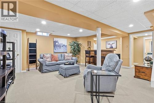 Living area with light colored carpet, a drop ceiling, and recessed lighting - 18 Webster Way, Georgetown, ON - Indoor