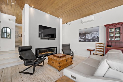 Salon - 2250 Ch. De L'Étang, Sainte-Adèle, QC - Indoor Photo Showing Other Room With Fireplace