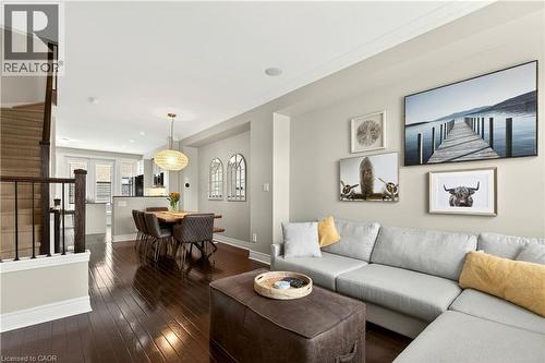 Living room with stairway and dark wood finished floors - 1862 Burnhamthorpe Road, Mississauga, ON - Indoor Photo Showing Living Room