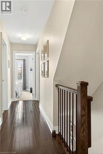 Corridor featuring dark wood-style flooring and an upstairs landing - 1862 Burnhamthorpe Road, Mississauga, ON - Indoor Photo Showing Other Room