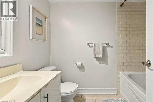 Bathroom with vanity, light tile patterned floors, and bathing tub / shower combination - 1862 Burnhamthorpe Road, Mississauga, ON - Indoor Photo Showing Bathroom