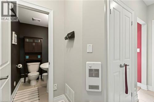 Bathroom with toilet and light tile patterned flooring - 1862 Burnhamthorpe Road, Mississauga, ON - Indoor Photo Showing Bathroom