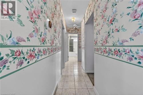 Corridor featuring wallpapered walls and light tile patterned flooring - 21 Bluebird Avenue, Hamilton, ON - Indoor Photo Showing Other Room