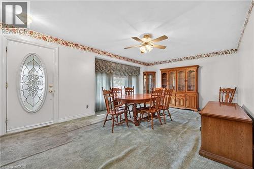 Dining area with ceiling fan and light carpet - 21 Bluebird Avenue, Hamilton, ON - Indoor Photo Showing Dining Room